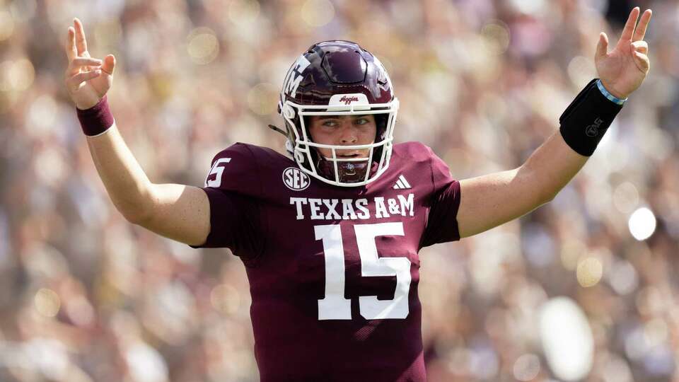 Texas A&M Aggies quarterback Conner Weigman (15) reacts after a 1-yard touchdown by running back Amari Daniels during the first quarter of a SEC conference college football game at Kyle Field, Saturday, Oct. 5, 2024, in College Station.