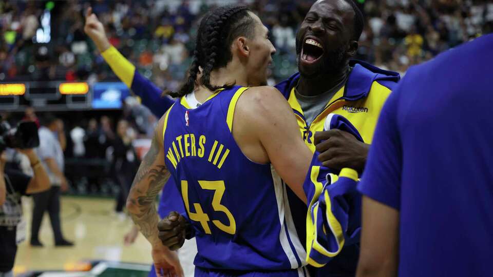 Golden State Warriors forward Lindy Waters III (43) reacts with forward Draymond Green (23) after Waters III mad a 3-pointer to defeat the Los Angeles Clippers in a preseason NBA basketball game, Saturday, Oct. 5, 2024 in Honolulu. The Warriors won 91-90. (AP Photo/Marco Garcia)