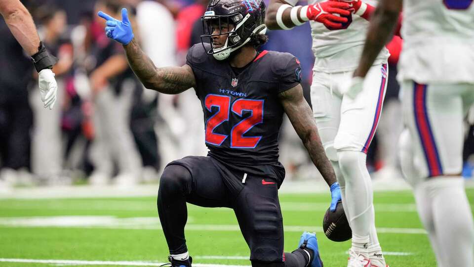 Houston Texans running back Cam Akers (22) signals after making a first down against the Buffalo Bills during the first half of an NFL football game Sunday, Oct. 6, 2024, in Houston.