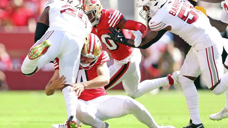 San Francisco 49ers’ Jake Moody is injured while tackling Arizona Cardinals’ DeeJay Dallas on a 2nd quarter kickoff return during NFL game at Levi’s Stadium in Santa Clara, Calif., on Sunday, October 6, 2024.