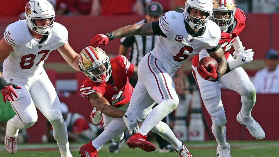 Arizona Cardinals’ James Connors rushes on game-winning drive against San Francisco 49ers’ Ji’Ayir Brown during Niners’ 24-23 loss in NFL game at Levi’s Stadium in Santa Clara, Calif., on Sunday, October 6, 2024.