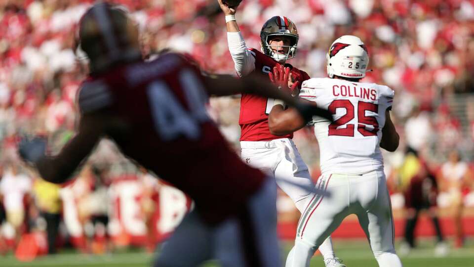 San Francisco 49ers’ Brock Purdy passes in 4th quarter against Arizona Cardinals’ Zaven Collins during Niners’ 24-23 loss in NFL game at Levi’s Stadium in Santa Clara, Calif., on Sunday, October 6, 2024.