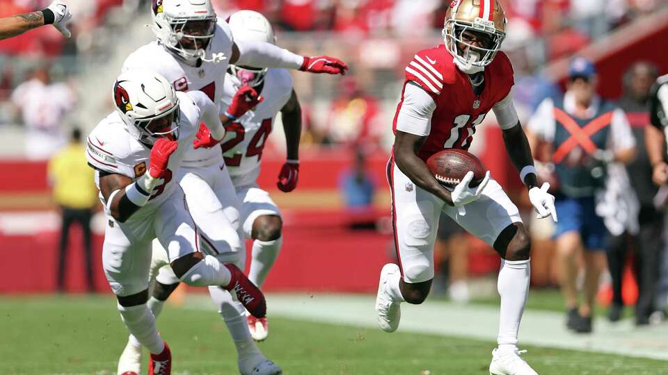 San Francisco 49ers’ Brandon Aiyuk runs after the catch during a 53-yard reception in 1st quarter against Arizona Cardinals during NFL game at Levi’s Stadium in Santa Clara, Calif., on Sunday, October 6, 2024.