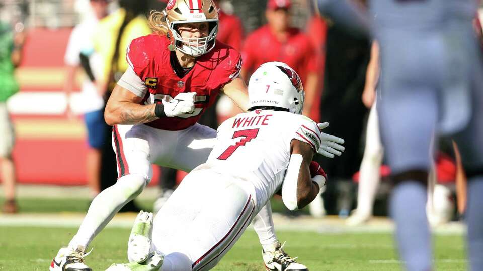 San Francisco 49ers’ George Kittle can’t prevent a game-clinching interception by Arizona Cardinals’ Kyzir White in 4th quarter of Niners’ 24-23 loss in NFL game at Levi’s Stadium in Santa Clara, Calif., on Sunday, October 6, 2024.