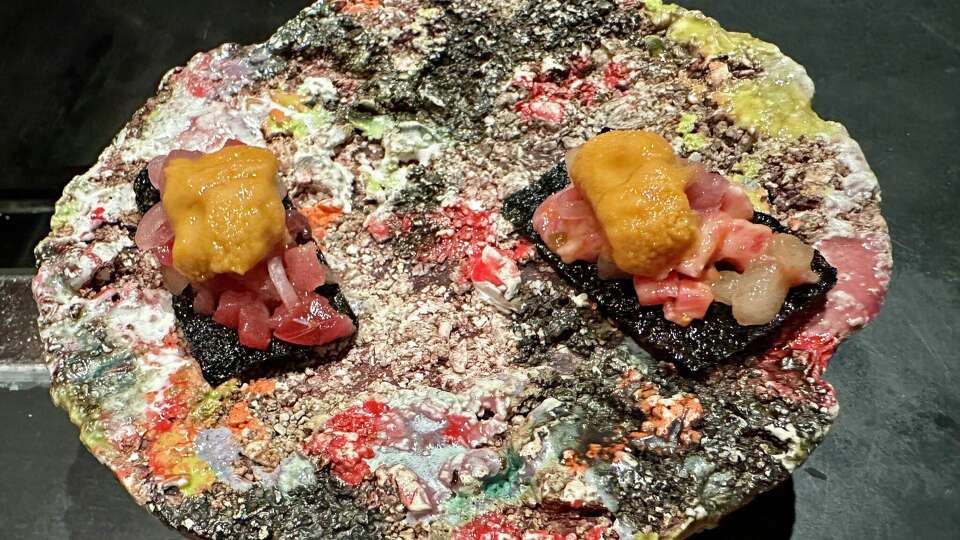 Uni with tuna (left) and wagyu (right) on a puffed nori chip at Robin.