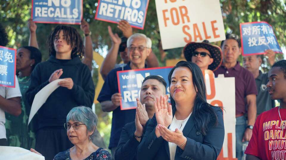 Embattled Oakland Mayor Sheng Thao listens to speeches of supporter during a rally opposing her recall at the Rockridge BART station in Oakland, California, on Sunday, October 6, 2024. Facing accusations of increasing crime in her city, as well as a recent FBI investigation, the mayor is fighting to retain her seat in the November elections.