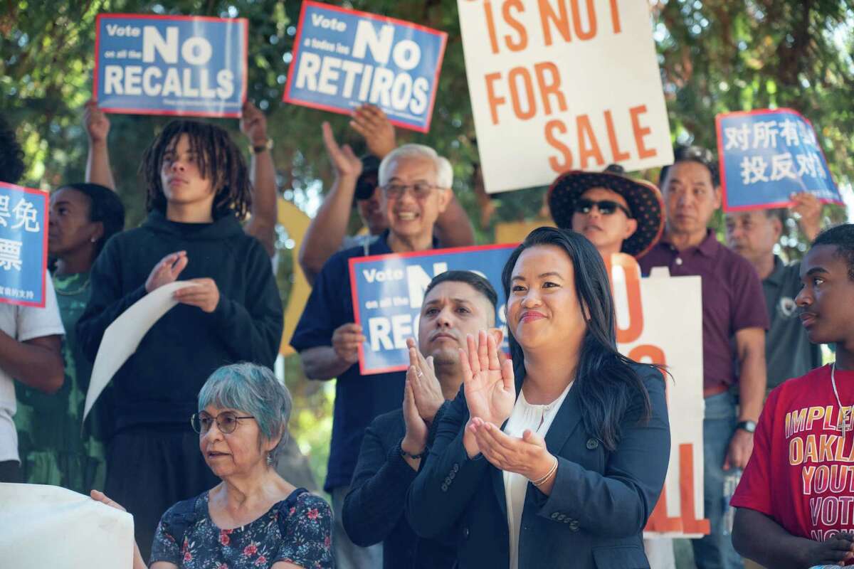 Embattled Oakland Mayor Sheng Thao listens to speeches of supporter during a rally opposing her recall at the Rockridge BART station in Oakland, California, on Sunday, October 6, 2024. Facing accusations of increasing crime in her city, as well as a recent FBI investigation, the mayor is fighting to retain her seat in the November elections.