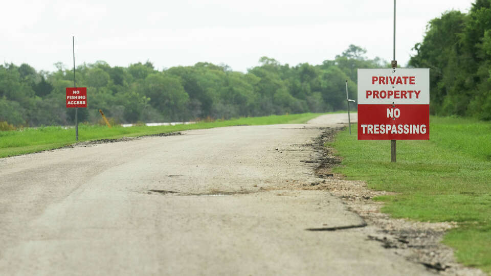 A private property sign is seen along a private road that CenterPoint Energy owns near South Cotton Lake Road, Thursday, July 18, 2024, in Beach City.