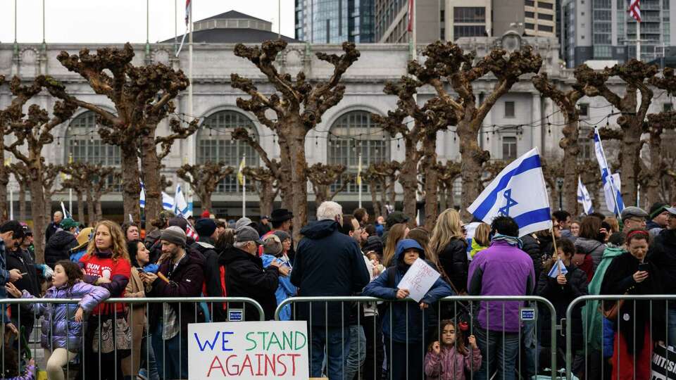 Participants of the Unity March Against Antisemitism, rally outside City Hall on Sunday, March 3, 2024.