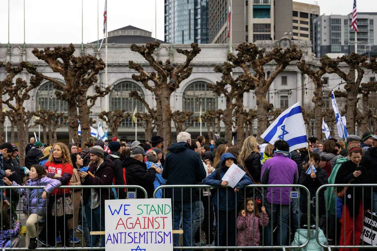 Participants of the Unity March Against Antisemitism, rally outside City Hall on Sunday, March 3, 2024.