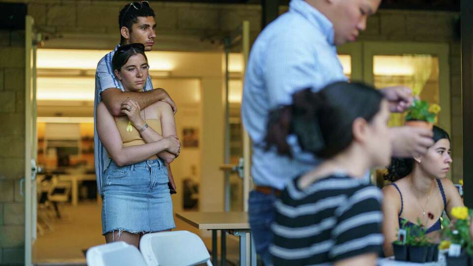 Students, who declined to give their names, embrace during a remembrance event for those killed or taken hostage during the October 7 Hamas attacks on Israel at Berkeley Hillel Jewish Student Center in Berkeley, Calif., on Monday, Oct. 7, 2024.