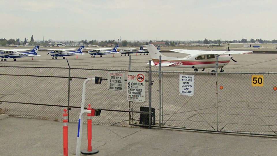 A row of private planes parked at Meadows Field Airport in Bakersfield, California. A woman with limited flight experience brought a twin-engine Beechcraft King Air 90 to a safe landing at the airport after her pilot husband suffered a heart attack mid-flight en route to Monterey from Las Vegas.