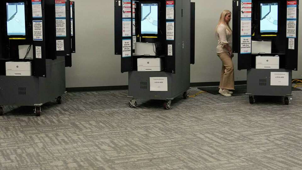 FILE - A person votes at a polling site for the presidential primary election on Tuesday, March 12, 2024, in Atlanta.