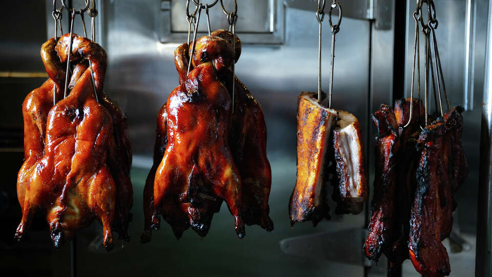 Roast duck hangs in the Go Duck Yourself restaurant chicken in Bernal Heights on Oct. 5, 2024.