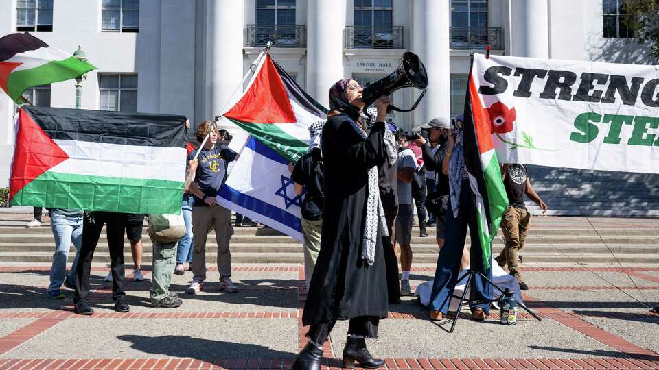 The UC Berkeley faculty, staff and students walk-out for Gaza and Lebanon was interrupted by counter protestors from Students Supporting Israel waving Israeli flags in Berkeley, Calif. on Tuesday, Oct. 8, 2024.