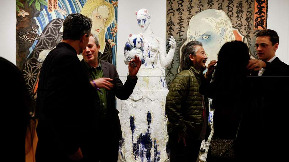 Wanxin Zhang, third from right, with his sculptures at the Catherine Clark Gallery during FOG Design+Art at Fort Mason in San Francisco on Wednesday, Jan. 17, 2023.