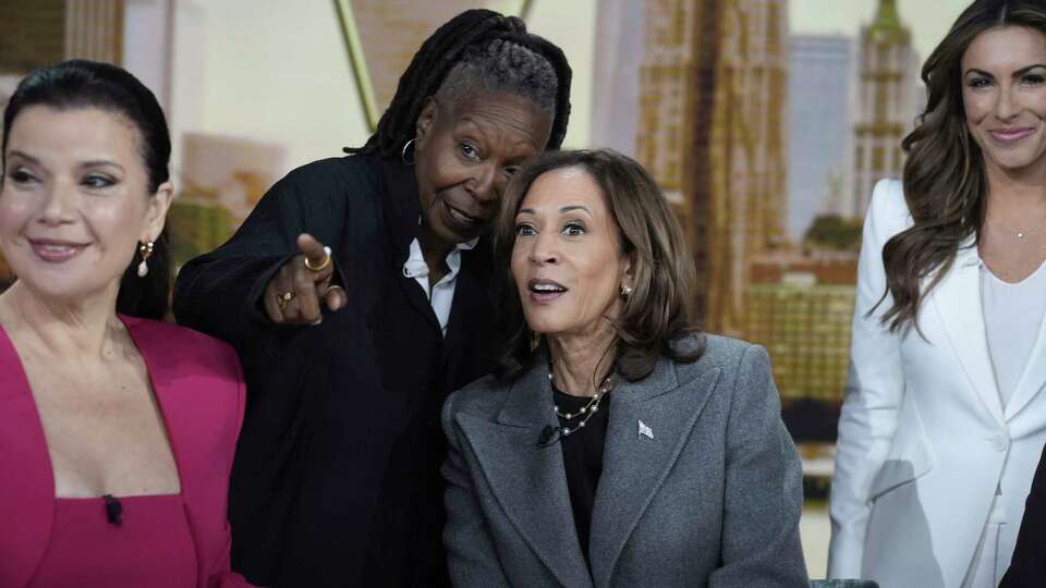 Democratic presidential nominee Vice President Kamala Harris chats with the hosts during a commercial break at The View, Tuesday, Oct. 8, 2024, in New York. From left are Ana Navarro, Whoopi Goldberg, Harris and Alyssa Farah Griffin. (AP Photo/Jacquelyn Martin)