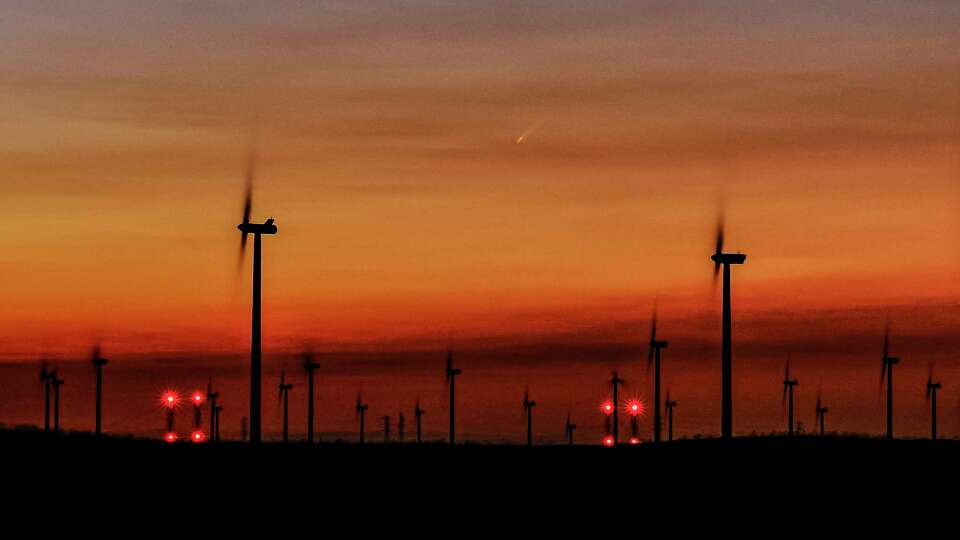 Comet C/2023 A3 (Tsuchinshan–ATLAS), rises before the sun over windmills outside Collinsville, Calif., on Tuesday, Oct. 1, 2024. The comet reached parihelion, it’s closest point to the sun, on September 27th, Its proximity to the sun will make it make it hard to see again until mid October when it will set just after the sun to the west.