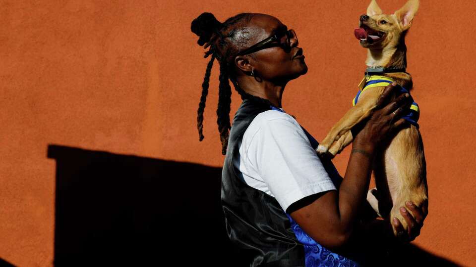 Jamesetta Guy, 61, poses for a portrait at home with her pet Chewy, her emotional support dog, in Oakland, Calif. on Wednesday, October 2, 2024. Guy, who was released from prison two years ago, served 41 years for a homicide she committed in 1981 at the age of 17. ...Sometimes it gets dark and, you know, I've always tried to hold on to that little peak of light at the end of the tunnel. That kept me fighting. Just surviving. Just trying to get there. I just had to hold on to that faith that God was not going to let this be my end in prison,” Guy said. “My heart is a good heart. I made a mistake. I was 17 years old, and I'm very sorry for that. If I could take it back, God knows I would.”