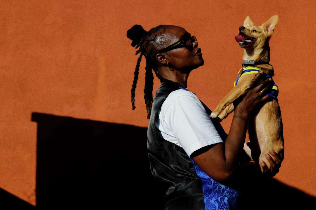 Jamesetta Guy, 61, poses for a portrait at home with her pet Chewy, her emotional support dog, in Oakland, Calif. on Wednesday, October 2, 2024. Guy, who was released from prison two years ago, served 41 years for a homicide she committed in 1981 at the age of 17. ...Sometimes it gets dark and, you know, I've always tried to hold on to that little peak of light at the end of the tunnel. That kept me fighting. Just surviving. Just trying to get there. I just had to hold on to that faith that God was not going to let this be my end in prison,” Guy said. “My heart is a good heart. I made a mistake. I was 17 years old, and I'm very sorry for that. If I could take it back, God knows I would.”