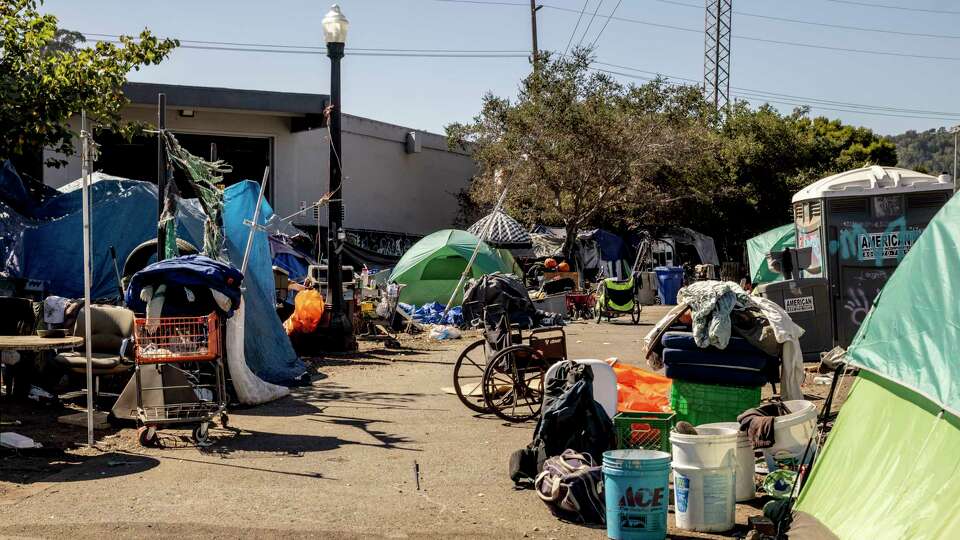 A homeless encampment is seen near Mahon Creek Path, across the street from a newly-opened and sanctioned camping site, in San Rafael, Calif., Tuesday, Oct. 8, 2024.