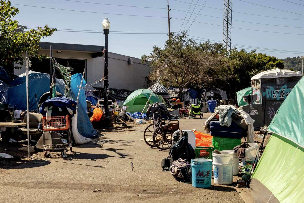 A homeless encampment is seen near Mahon Creek Path, across the street from a newly-opened and sanctioned camping site, in San Rafael, Calif., Tuesday, Oct. 8, 2024.