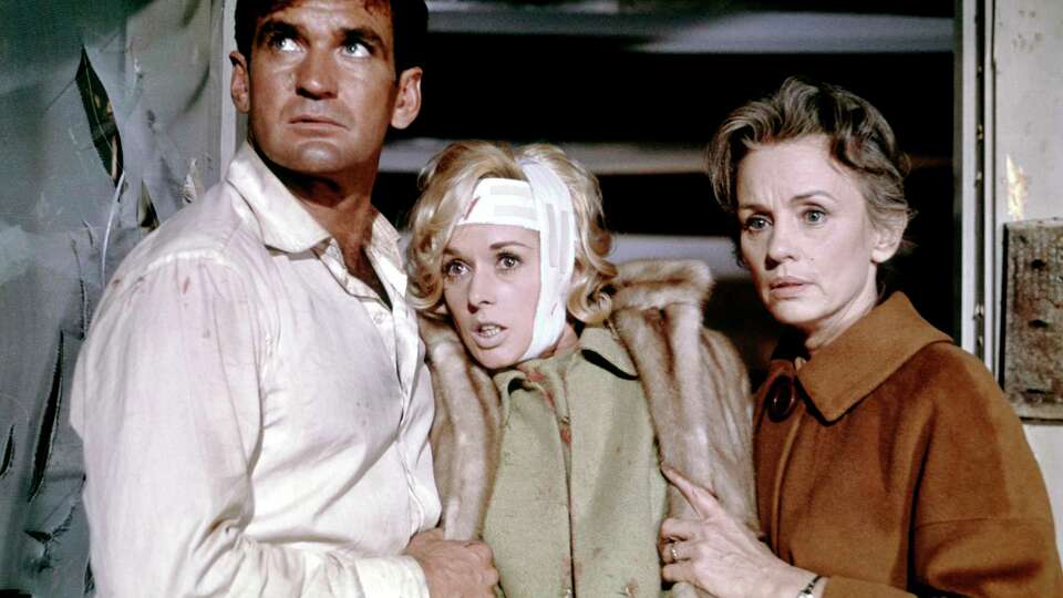 Australian actor Rod Taylor, American actress Tippi Hedren and British Jessica Tandy on the set of The Birds, directed and produced by Alfred Hitchcok.?