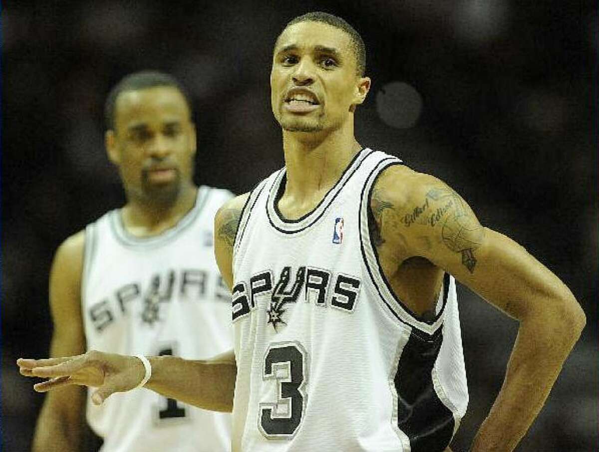 Spurs guard George Hill gestures to a teammate during Wednesday’s victory.