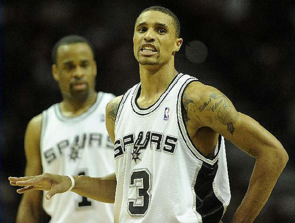Spurs guard George Hill gestures to a teammate during Wednesday?s victory.