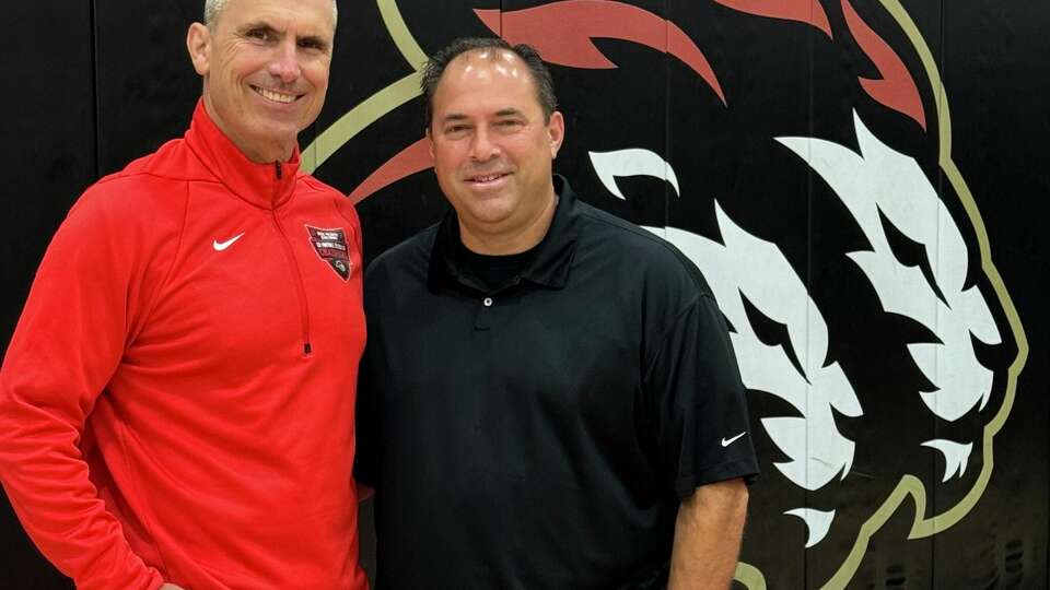 Salesian athletic director and football coach Chad Nightingale, left, with Salesian basketball coach Bill Mellis.