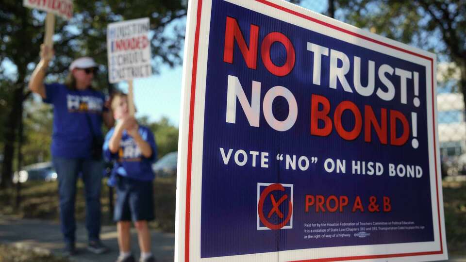 Families protest Houston ISD's $4.4 billion bond proposal before a Houston ISD board of managers meeting at the Hattie Mae White Educational Support Center, Thursday, Oct.10, 2024, in Houston.