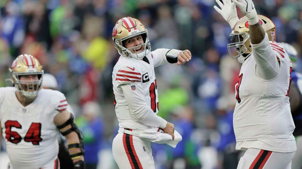 San Francisco 49ers quarterback Brock Purdy (13) react during the first half of an NFL football game against the Seattle Seahawks, Thursday, Oct. 10, 2024, in Seattle. (AP Photo/John Froschauer)