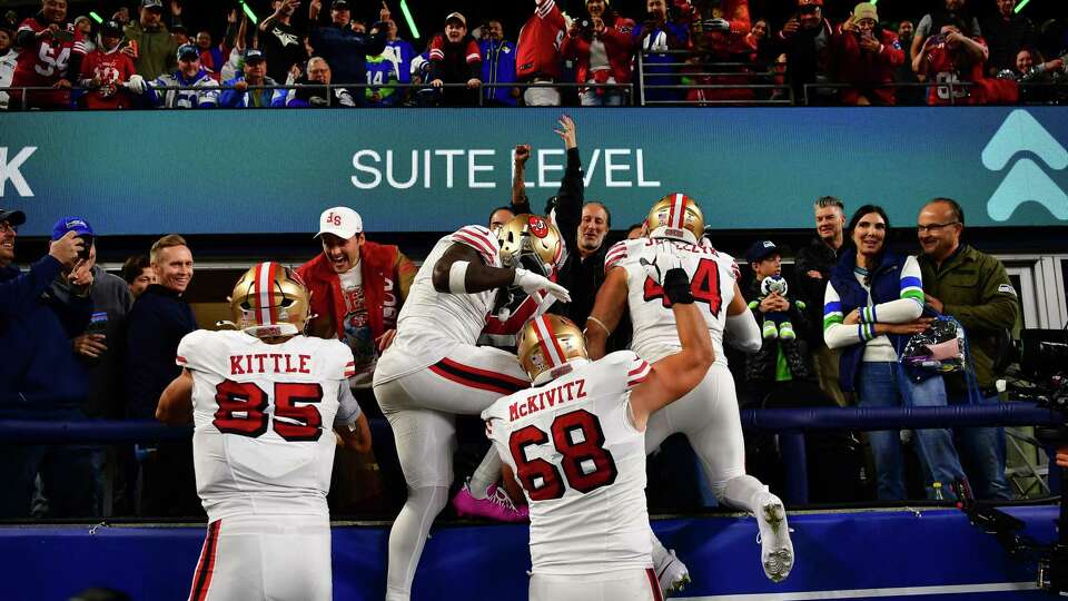 SEATTLE, WASHINGTON - OCTOBER 10: Kyle Juszczyk #44 of the San Francisco 49ers celebrates with teammates after scoring a touchdown during the fourth quarter against the Seattle Seahawks at Lumen Field on October 10, 2024 in Seattle, Washington.