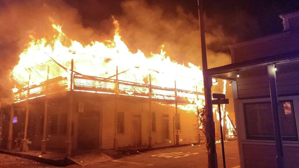 A wooden building caught fire and burned down on Main Street in Sutter Creek. 