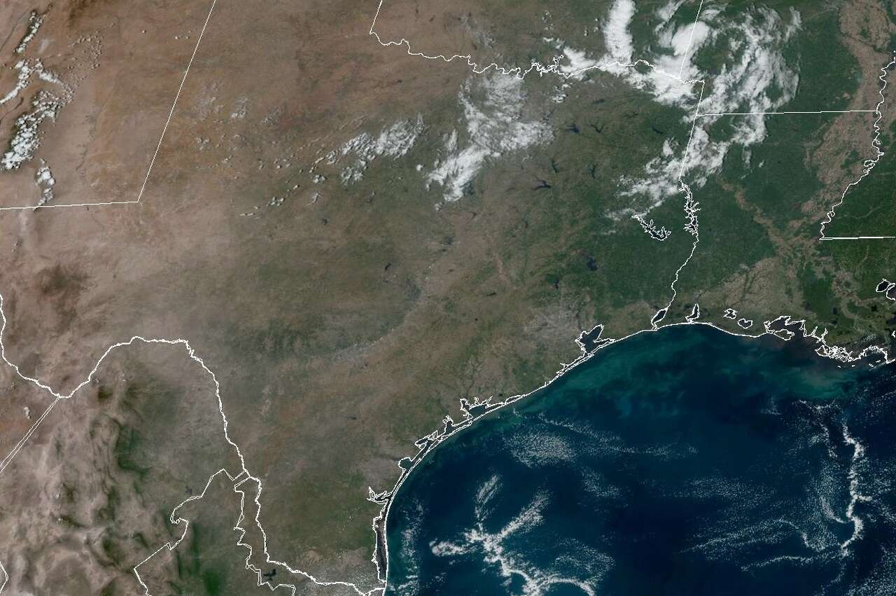 In this weather satellite photo of Texas taken Friday afternoon, skies over the Lone Star State are mostly clear. Thanks to systems of high atmospheric pressure, clear skies should persist through the weekend and into early next week.