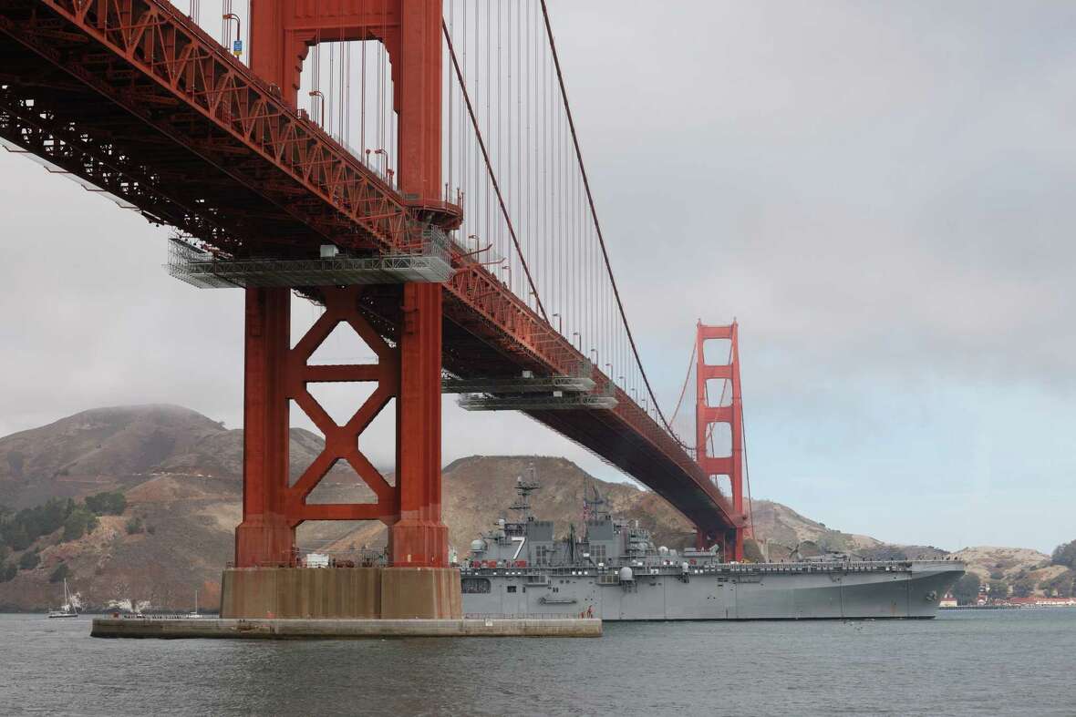 The first ship passes under the Golden Gate Bridge for the Parade of Ships during Fleet Week on Friday, October 11, 2024 in San Francisco, Calif.