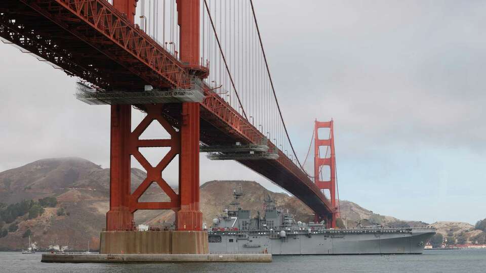 The first ship passes under the Golden Gate Bridge for the Parade of Ships during Fleet Week on Friday, October 11, 2024 in San Francisco, Calif.