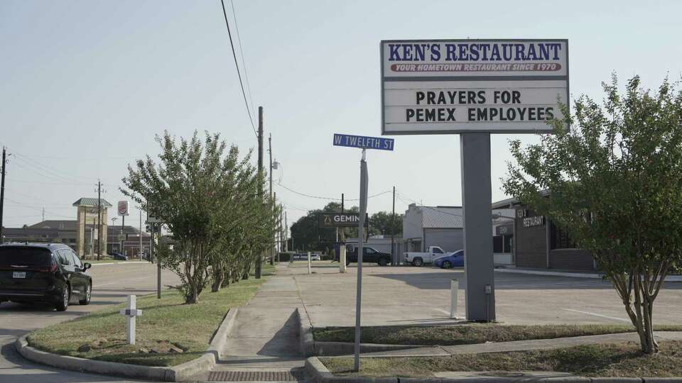 A sign offering prayers for the Pemex refinery workers, who were killed by a release of the chemical hydrogen sulfide, is photographed in front of Ken's Restaurant on Friday, Oct. 11, 2024 in Deer Park.