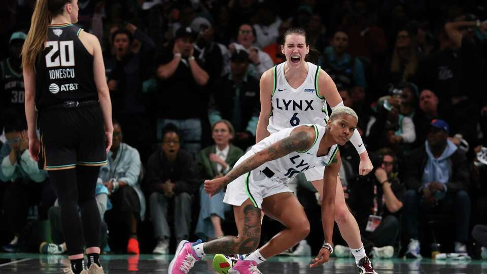 NEW YORK, NEW YORK - OCTOBER 10: Courtney Williams #10 and Bridget Carleton #6 of the Minnesota Lynx react after being fouled during the second half against the New York Liberty during Game One of the WNBA Finals at the Barclays Center on October 10, 2024 in New York City.