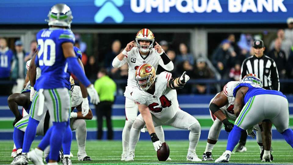 SEATTLE, WASHINGTON - OCTOBER 10: Brock Purdy #13 of the San Francisco 49ers signals at the line during the third quarter against the Seattle Seahawks at Lumen Field on October 10, 2024 in Seattle, Washington.