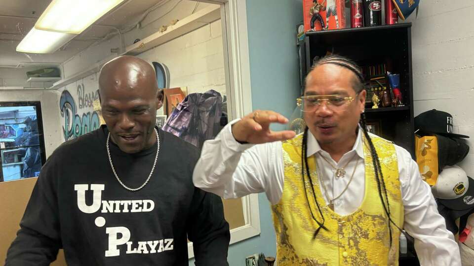 John Windham, left, and United Playaz Director Rudy Corpuz celebrate the nonprofit's anniversary.