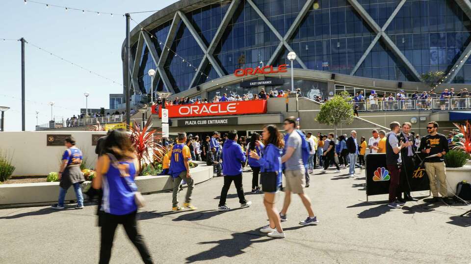 Warriors fans walk outside of Oracle Arena ahead of Game 4 of the NBA Finals between the Golden State Warriors and the Toronto Raptors in Oakland, California, on Friday, June 7, 2019.