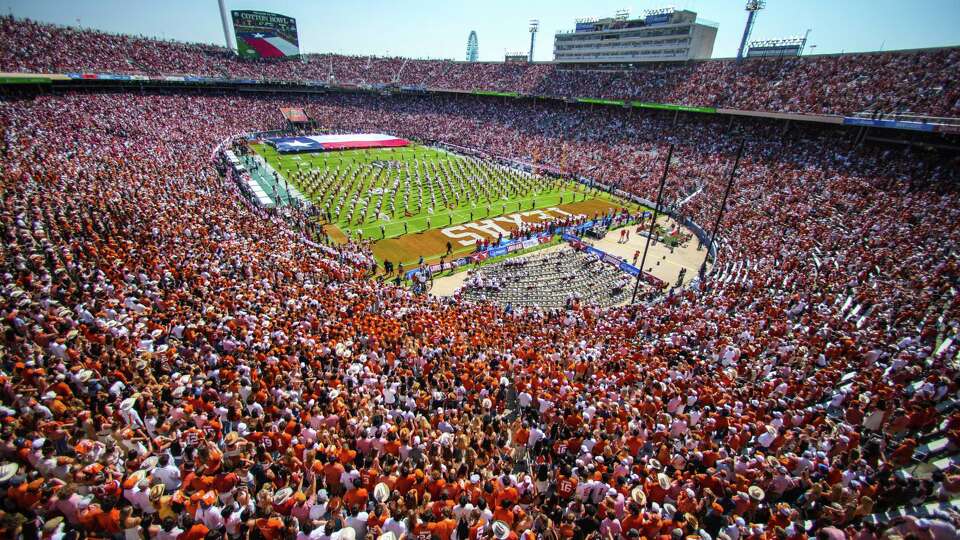 Fans take in an NCAA college football game between Texas and Oklahoma at the Cotton Bowl, Saturday, Oct. 12, 2024, in Dallas.