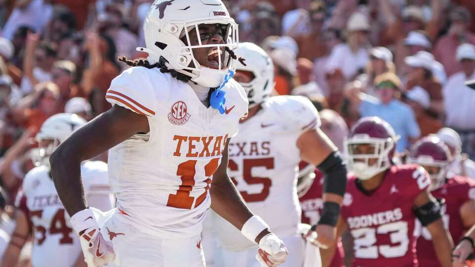 Texas' Silas Bolden reacts after recovering a fumble by running back Quintrevion Wisner in the end zone for a touchdown during the second quarter of an NCAA college football game at the Cotton Bowl, Saturday, Oct. 12, 2024, in Dallas.