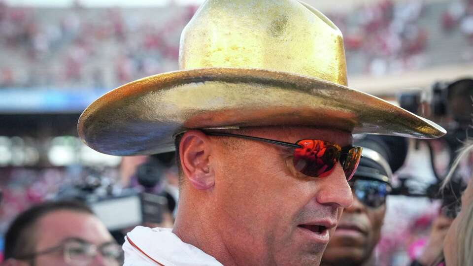 Texas Longhorns head coach Steve Sarkisian wears the Golden Hat trophy after defeating Oklahoma 34-3 during an NCAA college football game between Texas and Oklahoma at the Cotton Bowl, Saturday, Oct. 12, 2024, in Dallas.