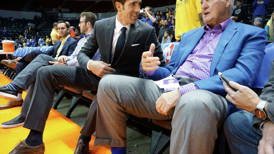 Warriors' GM Bob Myers chats with Jerry West before game against the LA Lakers at the Valley View Casino Center in San Diego, CA on Wednesday, October 19, 2016. In addition to building what is expected to be a historically good Warriors team, Myers has been helping his sister-in-law through tragedy. His brother-in-law was killed in a hiking accident in Africa - which his sister-in-law witnessed.