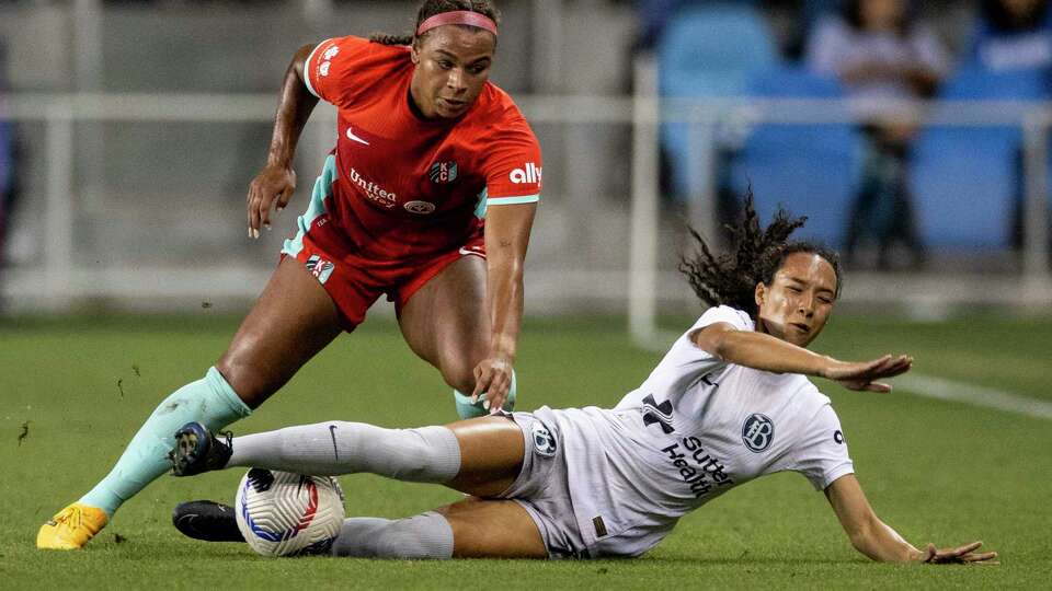 Bay FC defender Alyssa Malonson (20) collides with Kansas City Current forward Michelle Cooper (17) during the first half of their NWSL soccer match in San Jose, Calif., Saturday, Oct. 12, 2024.