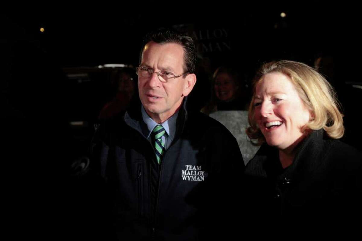 Democratic gubernatorial candidate Dan Malloy, left, and his wife Cathy talk to reporters before voting at Our Lady Star of the Sea on Election Day, Tuesday, Nov. 2, 2010 in Stamford, Conn.