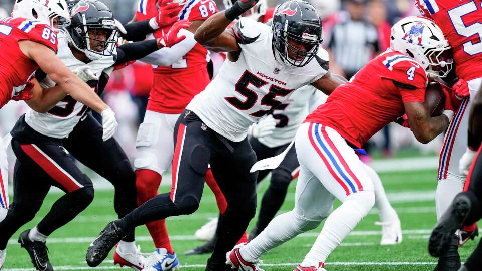 Houston Texans defensive end Danielle Hunter (55) closes in on New England Patriots running back Antonio Gibson (4) as Gibson runs into his teammate during the first half of an NFL football game Sunday, Oct. 13, 2024, in Foxborough, Mass.