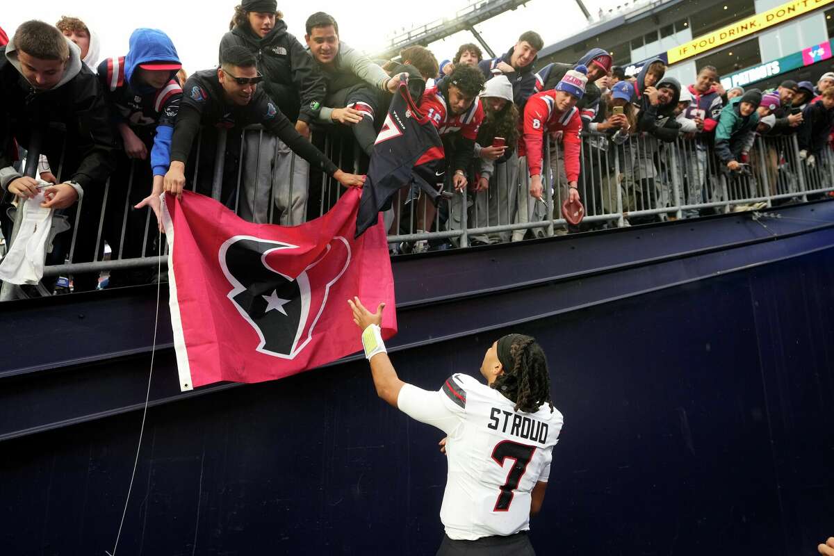 Houston Texans quarterback C.J. Stroud greets fans following an NFL football game against the New England Patriots, Sunday, Oct. 13, 2024, in Foxborough, Mass.